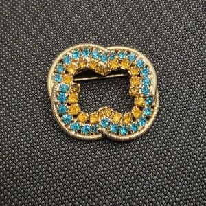 Elegant Gold and Blue Brooch